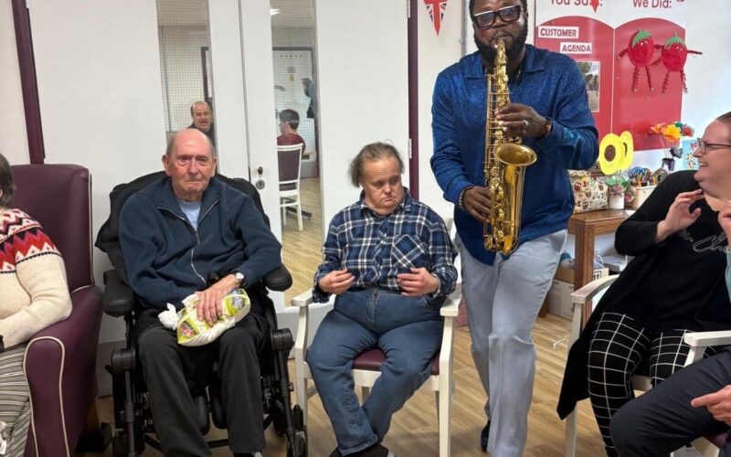 Mike playing the saxophone for ECL customers.