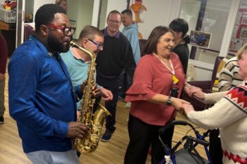 ECL customers and staff enjoying Mike's performance.