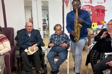 Mike playing the saxophone for ECL customers.