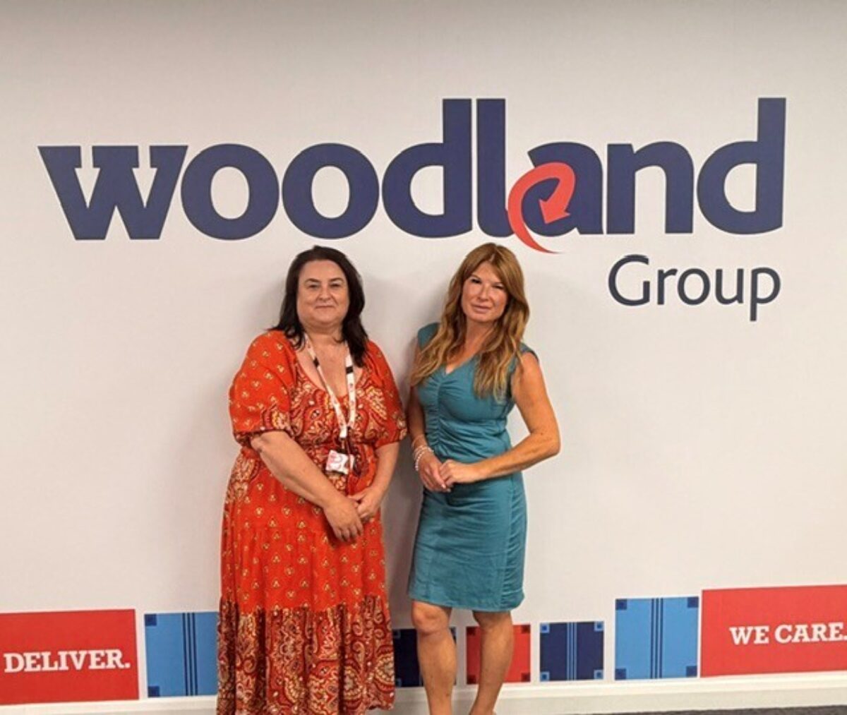 Recruitment Manager, Claire and ECL Job Broker, Jenny price standing in front of the Woodland Group logo