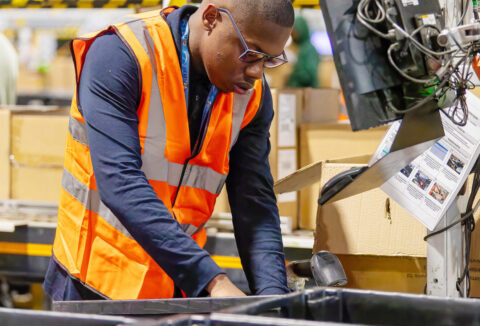 Young male intern working at Amazon