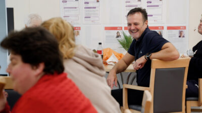 Nick observing customers sitting around the tables