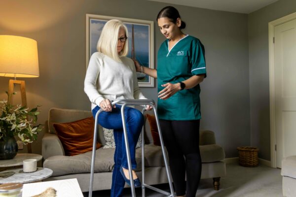 Occupational therapist supporting customer doing exercises