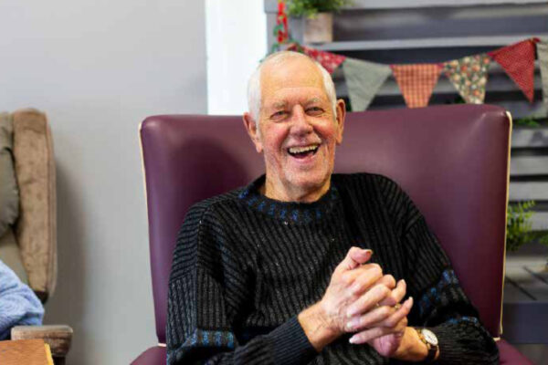 An elderly man smiling