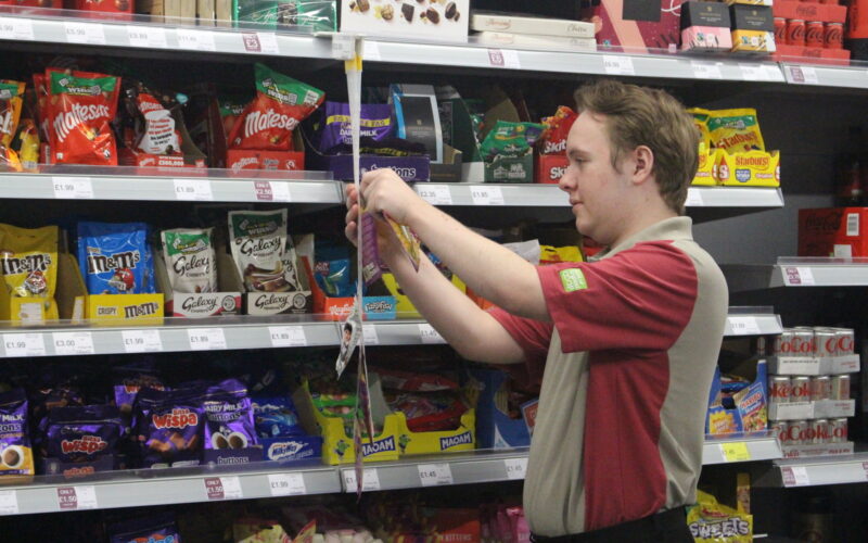 A man working in a shop.