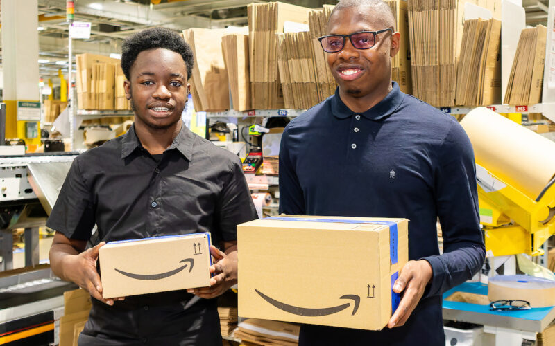 Graduates Timi and Hayden at work in Amazon's LCY2 site