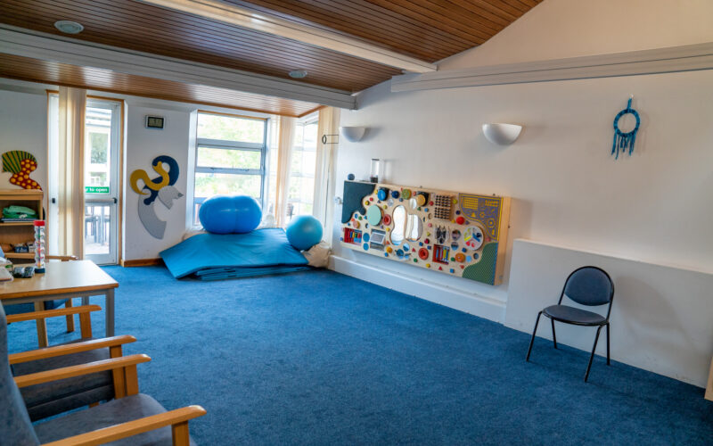 Therapy room at Braintree, a light bright, pleasing room with mats and equipment.