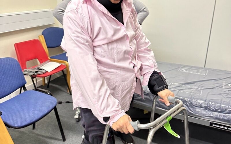 A woman using a walker