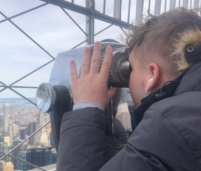 Lynden is so enthralled by the view from the Empire State Building he actually looks up from his phone!