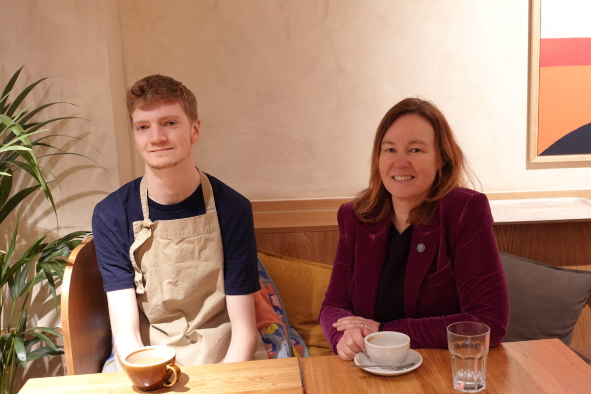 A young man, Michael, sitting next to Marie Goldman, Colchester MP