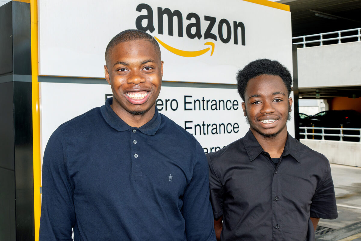 Two amazon supported internship candidates smiling at the camera