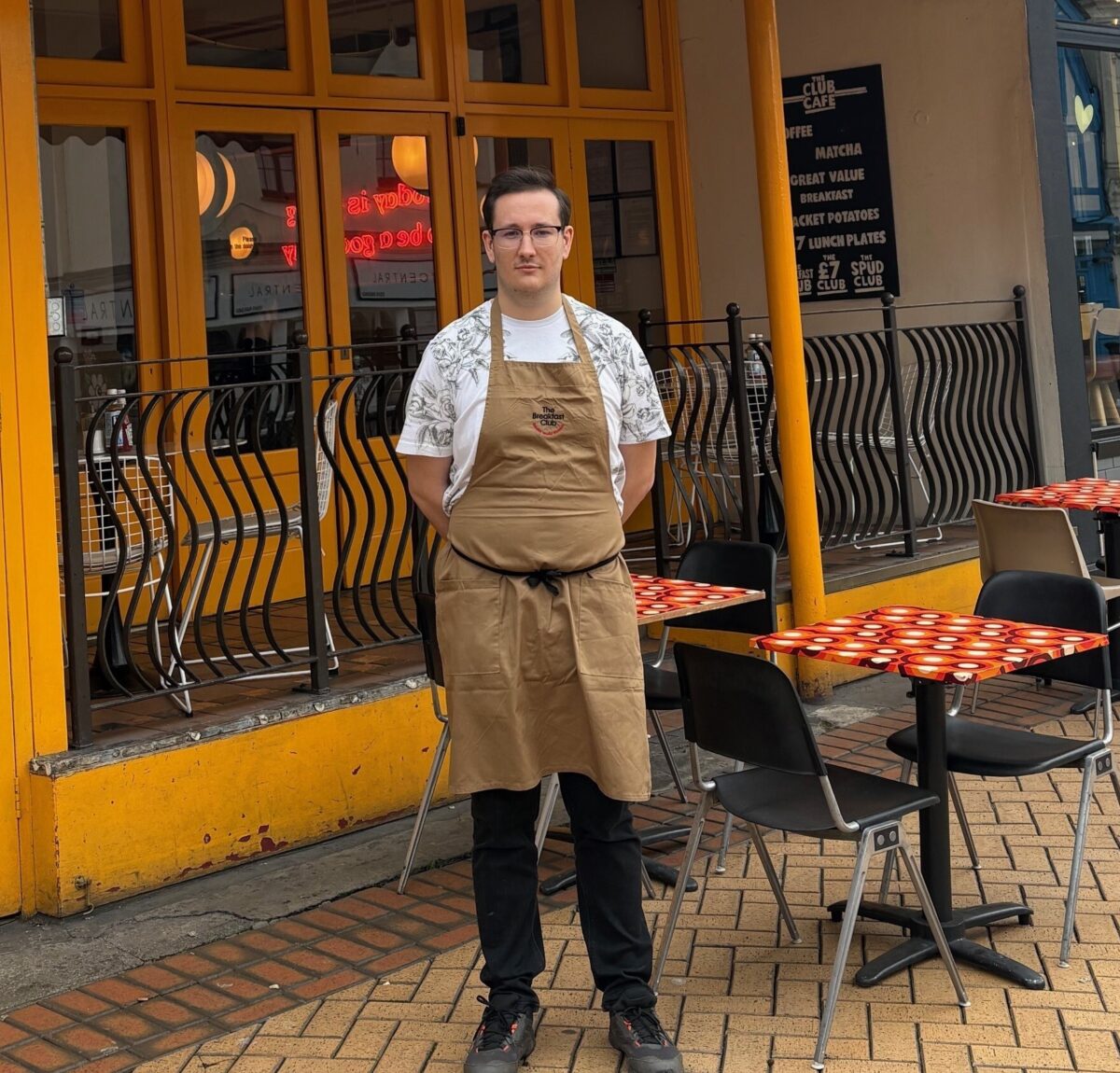 Young man outside a cafe in Chelmsford.