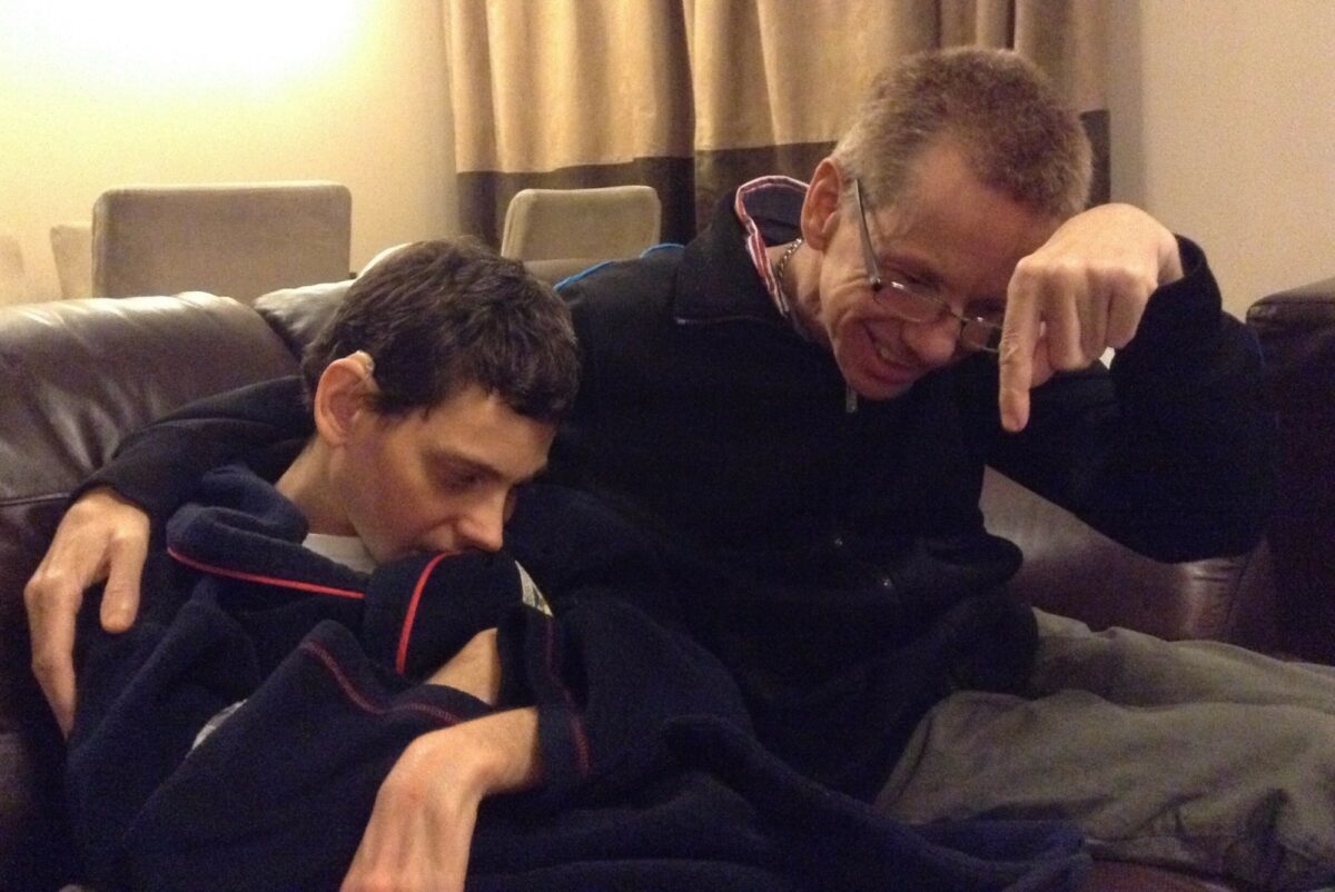 Image of two adult male siblings with learning disabilities and impaired eyesight