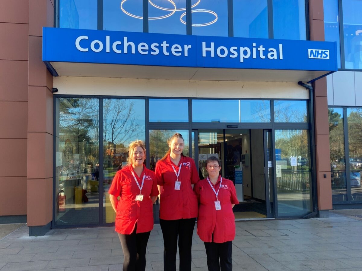 Three carers standing together outside of Colchester hospital