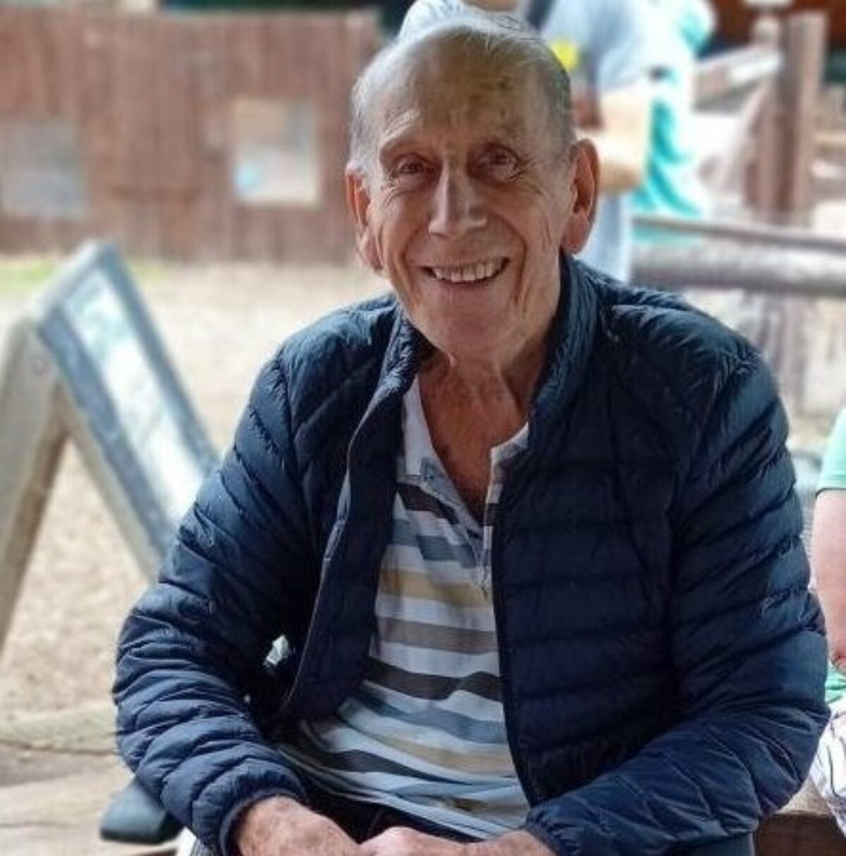 Alan smiling at the camera