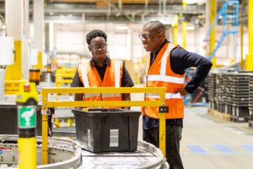 Graduates Timi and Hayden at work in Amazon's LCY2 site