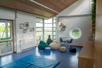 A second therapy room at Braintree day centre. A light bright room with floor mats and bean bags