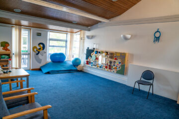 Therapy room at Braintree, a light bright, pleasing room with mats and equipment.