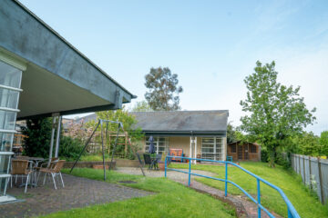 The outdoor area at Braintree day centre with lawn and seating area