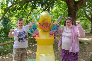 ECL Customers Lorna and Craig with one of the Buzz in the City large bee sculptures in Chelmsford.