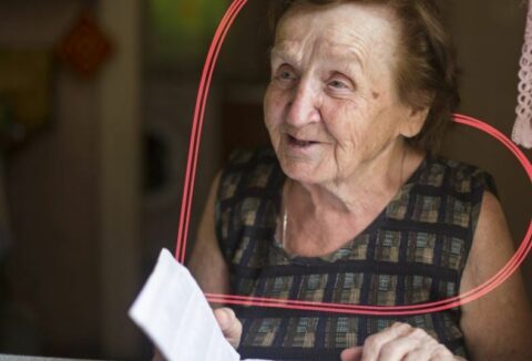 An elderly woman smiling
