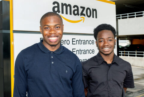 Two amazon supported internship candidates smiling at the camera