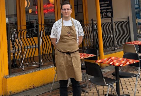 Young man outside a cafe in Chelmsford.