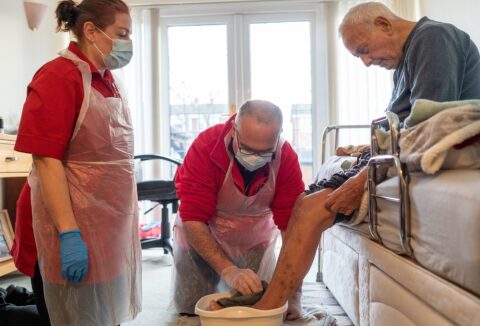 Care Assistant Vanessa The Mayor and customer Roy SMALL