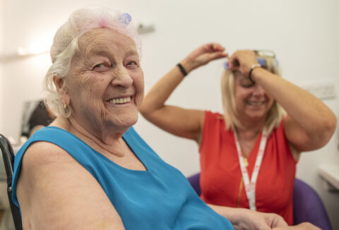 Older person getting their hair cut.