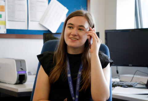 Photo of Maisie speaking on the telephone