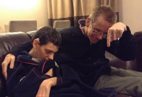 Image of two adult male siblings with learning disabilities and impaired eyesight