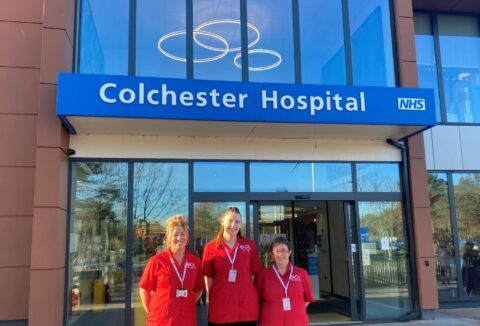 3 Employees standing outside Colchester Hospital