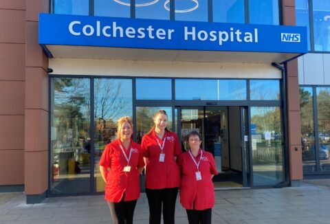 Three carers standing together outside of Colchester hospital