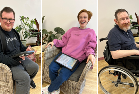 Pictures of three people put together - first one on the left is of a man with glasses, sitting down and playing with an ipad while looking at the camera. He's wearing grey sweat pants, black tshirt and black hoodie. Image in the middle represents a woman sitting in a chair and leaning back. She's wearing a pink hoodie, jeans and white trainers. The image to the right showcases a man with a grey beard sitting in a wheelchair and looking at the camera.