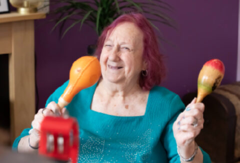 A woman playing an instrument